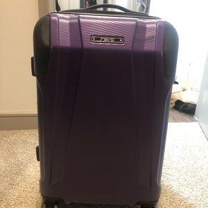 Slight used four wheel suitcase.